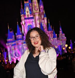 Photo of the blogger in front of the castle in Disney World.