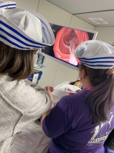 Manda and Alicia practice using endoscopy at DDW. 