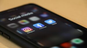 an iPhone with social media applications. 